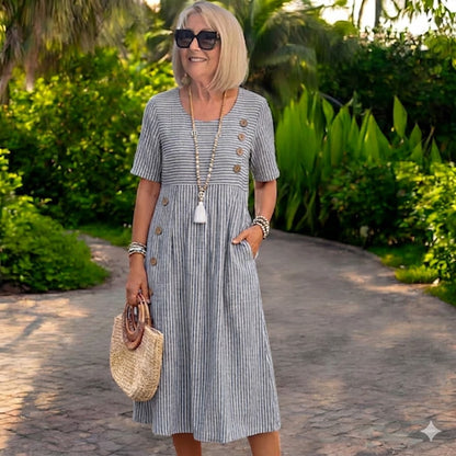 💖👗【S-2XL】Julia – Ľahké a splývavé pruhované midi šaty - zvislé pruhy opticky predlžujú siluetu a vytvárajú elegantnejší vzhľad.
